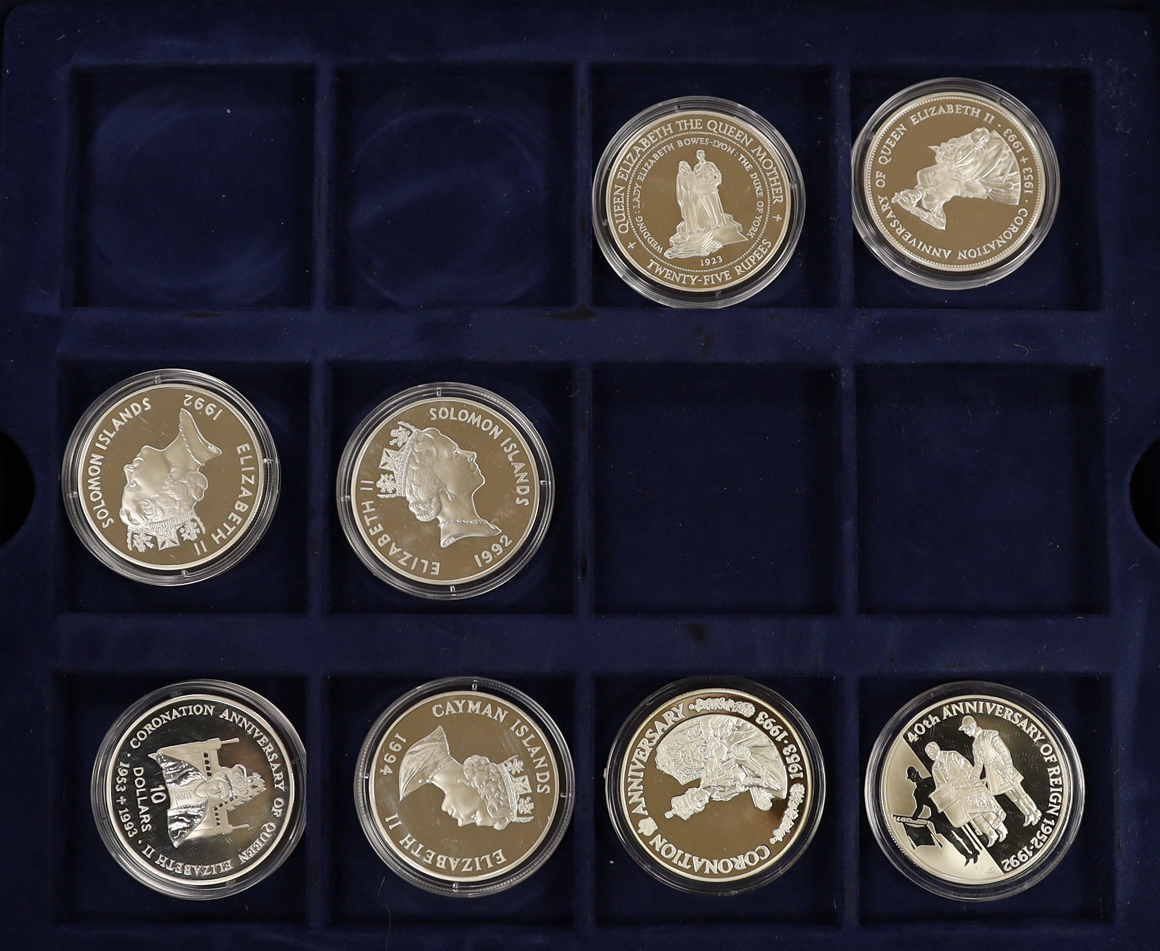 A collection of Royal Mint, Westminster mint and MDM QEII Commonwealth proof silver Royal family commemorative coins, and nine cased Royal Mint silver proof c.1992-95, in four large cases